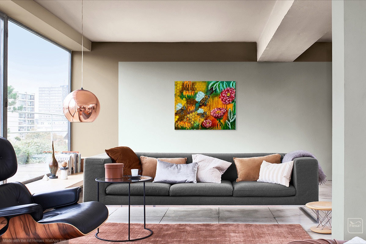 Bee wall art painting by William Tucker Art displayed above gray sofa in modern living room